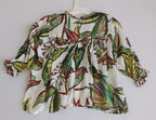 Blusa con botones atrás