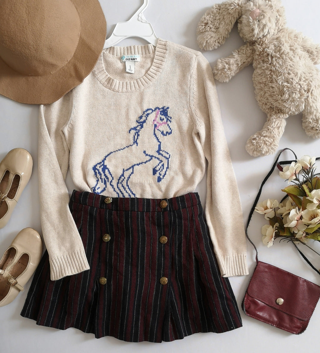 Suéter largo y falda con paletones