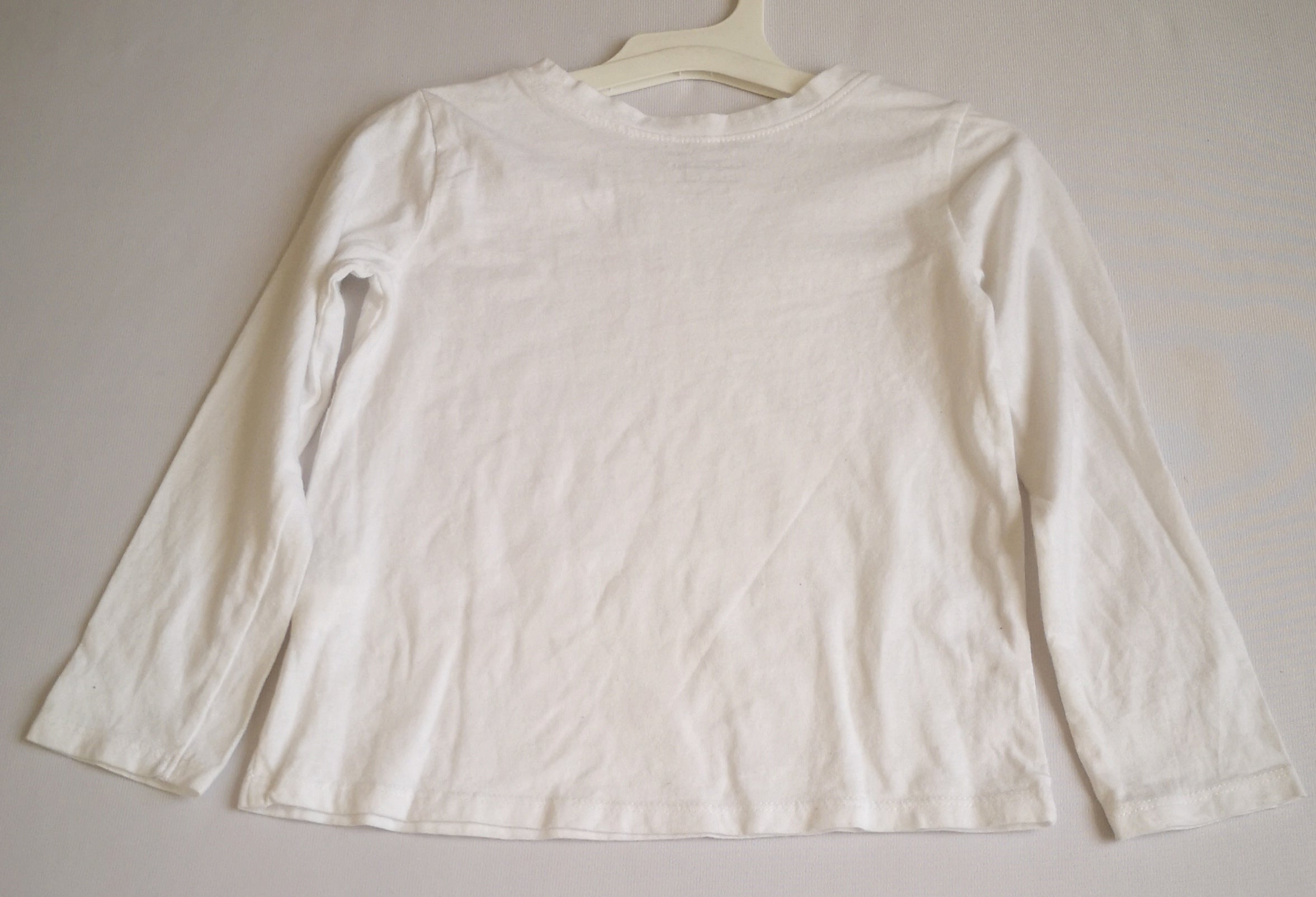 Blusa manga larga y pantalón con detalles en la tela