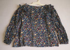 Blusa con jeans rasgado