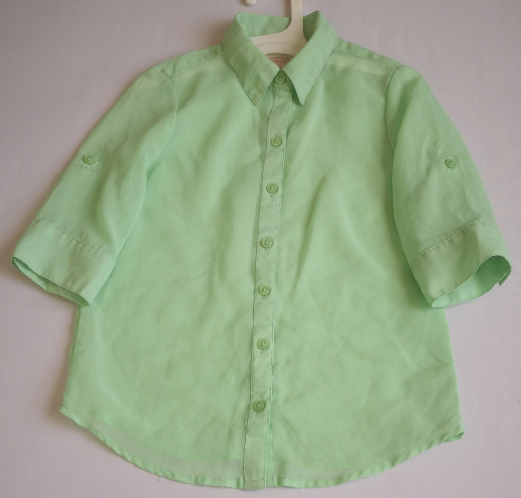 Blusa y falda con bolsas a los lados