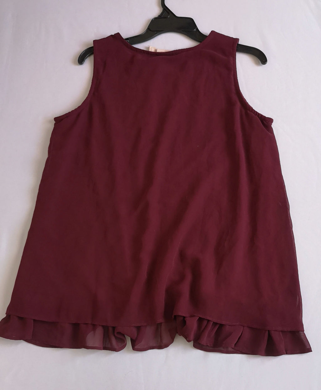 Blusa larga con olanes abajo