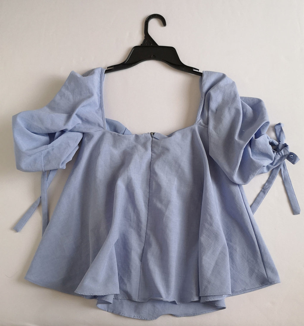 Blusa cuello cuadrado holgada de abajo