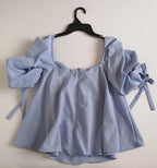 Blusa cuello cuadrado holgada de abajo