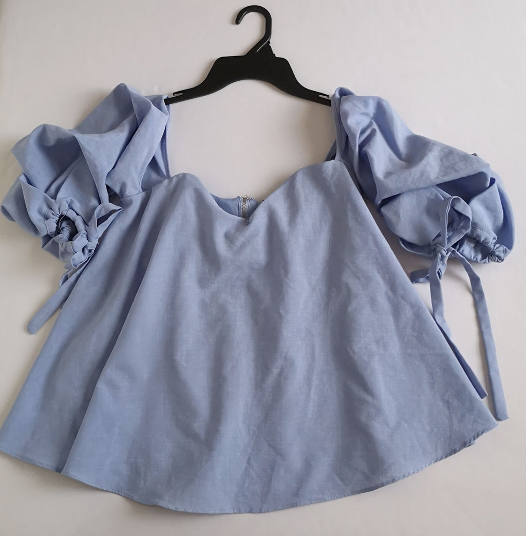 Blusa cuello cuadrado holgada de abajo