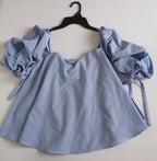 Blusa cuello cuadrado holgada de abajo