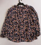 Blusa de chifón y falda con bolsas a los lados