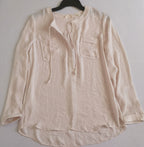 Blusa con bolsas adelante