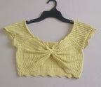 Pantalón slouchy cintura alta y crop top tejido