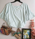 Blusa bordada de las mangas