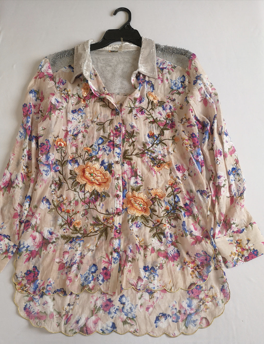 Blusa larga bordada
