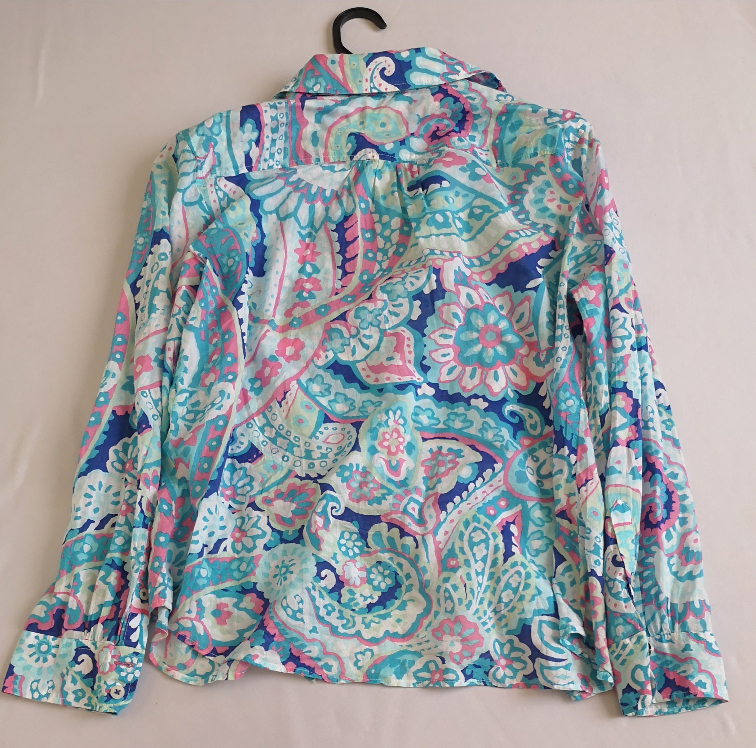 Blusa manga larga y short con bolsas a los lados