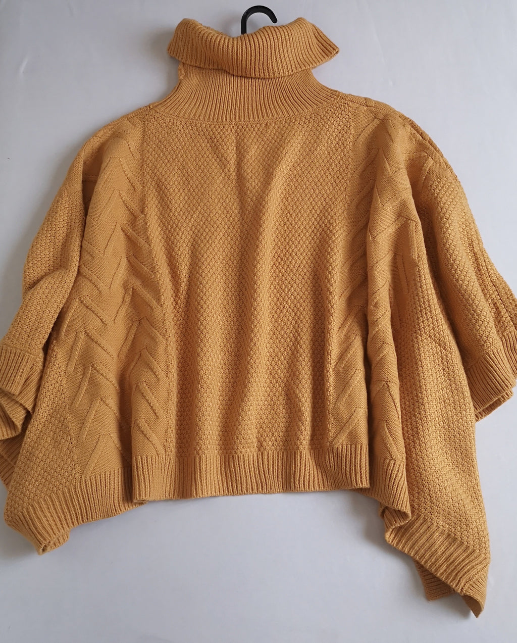Poncho cuello alto