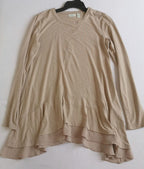 Blusa larga con bolsas a los lados