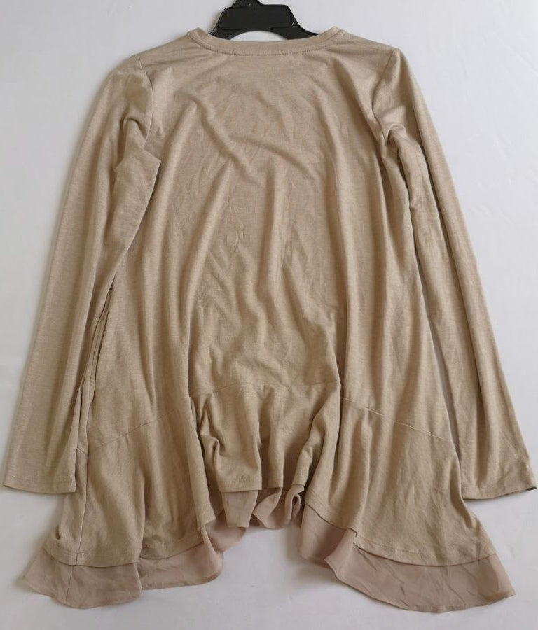 Blusa larga con bolsas a los lados