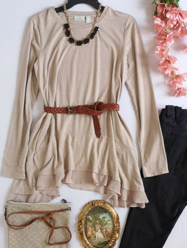 Blusa larga con bolsas a los lados