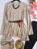 Blusa larga con bolsas a los lados