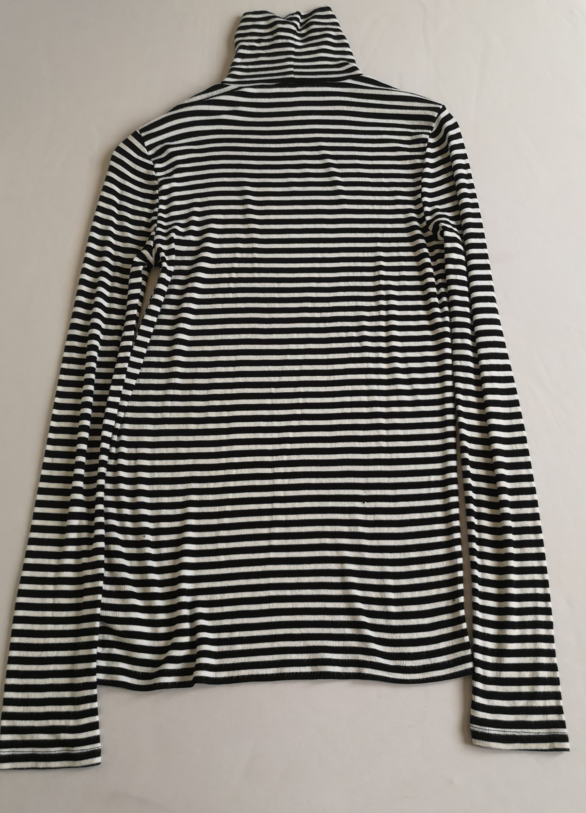 Blusa larga cuello alto