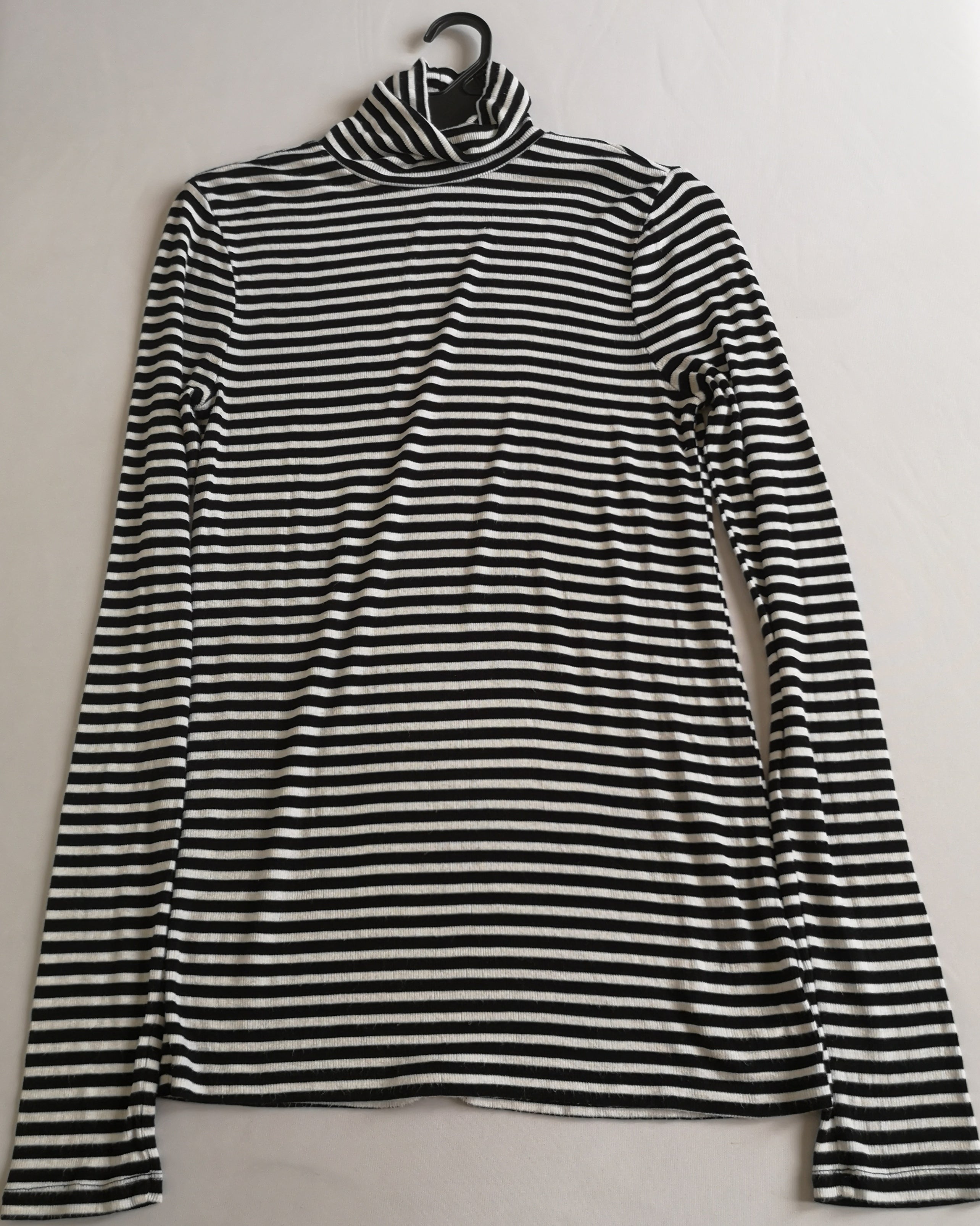 Blusa larga cuello alto