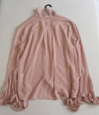 Blusa mangas campana con jeans skinny