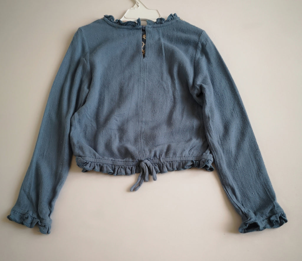 Jeans con blusa bordada