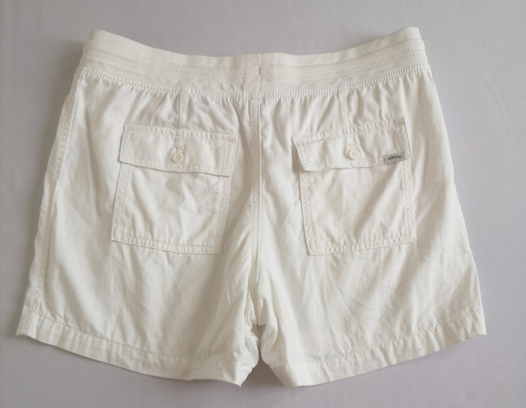 Short con bolsas y blusa tipo seda