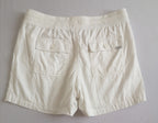 Short con bolsas y blusa tipo seda