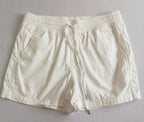 Short con bolsas y blusa tipo seda