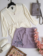 Blusa tejida con falda corta bordada