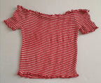 Blusa corta hombros descubiertos y short con bolsas