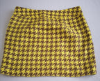 Sueter tipo over size y falda con bolsas a los lados