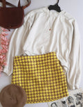Sueter tipo over size y falda con bolsas a los lados
