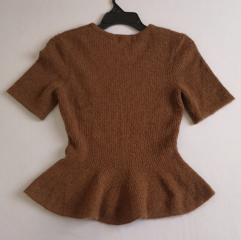 Blusa tipo peplum tejida