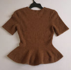 Blusa tipo peplum tejida