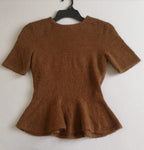 Blusa tipo peplum tejida