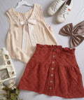 Blusa con moña y falda de algodón