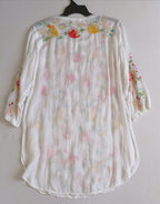 Blusa larga bordada