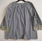 Short cintura alta con blusa bordada