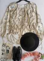 Blusa con cintas tipo peplum