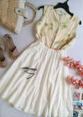 Falda midi con bolsas y blusa de seda