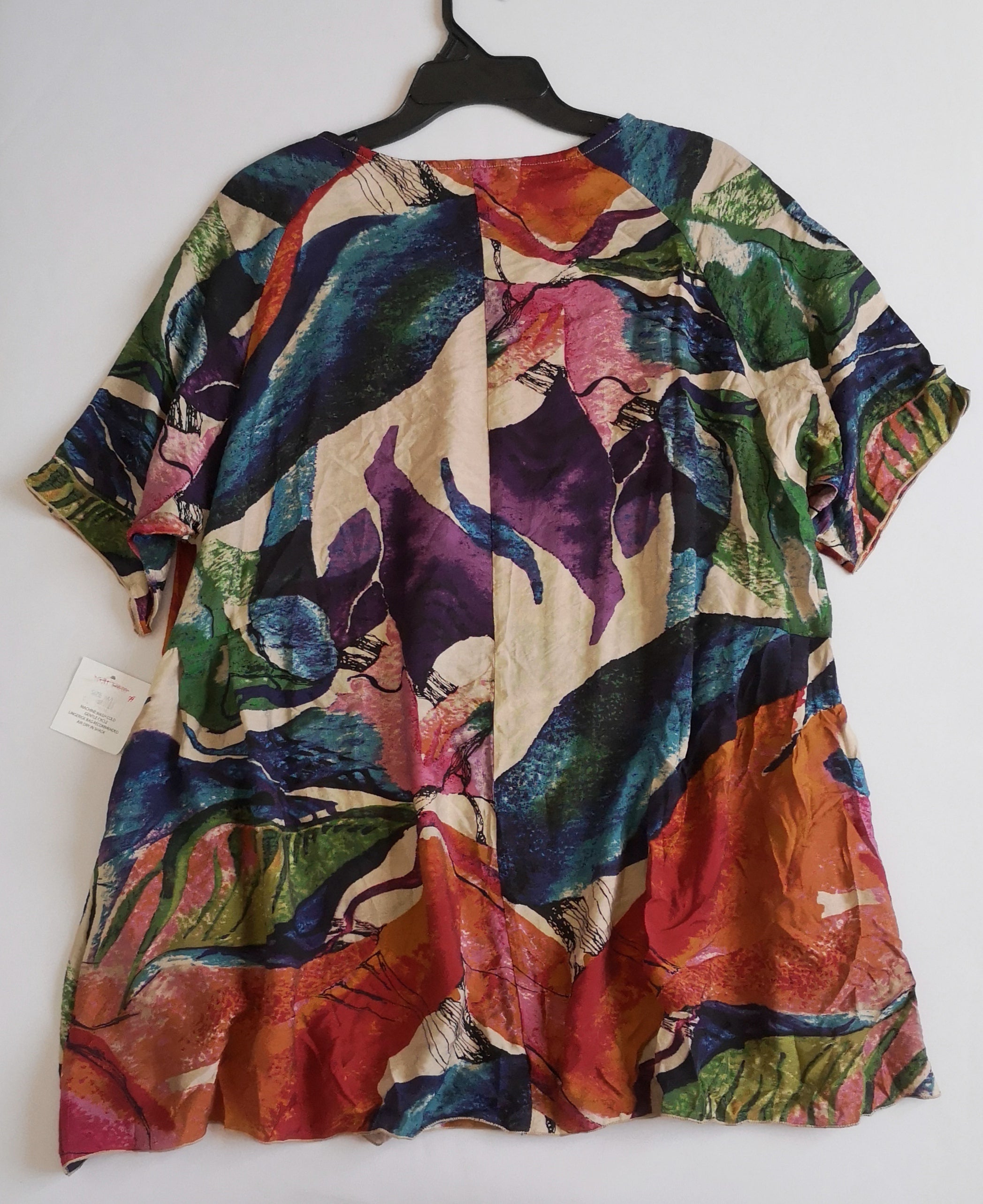 Blusa larga nueva con bolsas a los lados