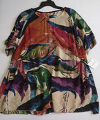 Blusa larga nueva con bolsas a los lados