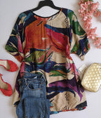 Blusa larga nueva con bolsas a los lados