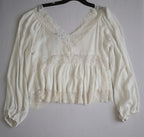 Blusa tipo peplum con encaje
