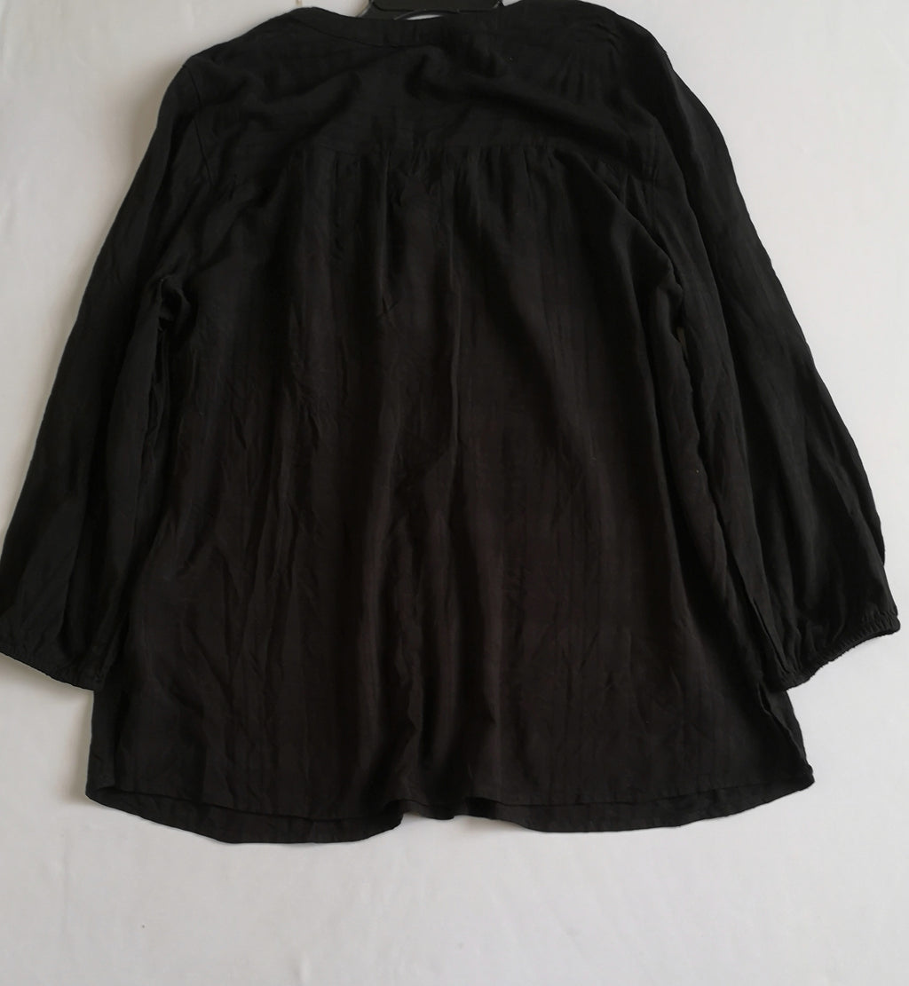 Blusa tipo boho con falda asimétrica