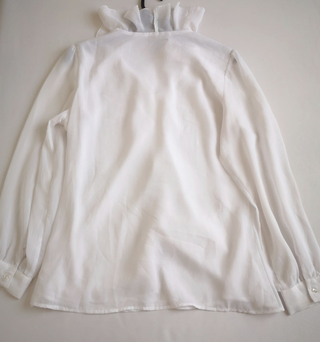 Blusa con olanes y pantalón semiformal
