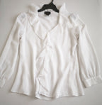 Blusa con olanes y pantalón semiformal