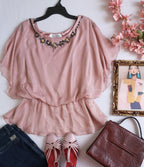 Blusa tipo peplum bordada
