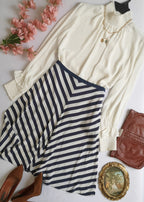 Falda midi de seda con blusa cuello alto