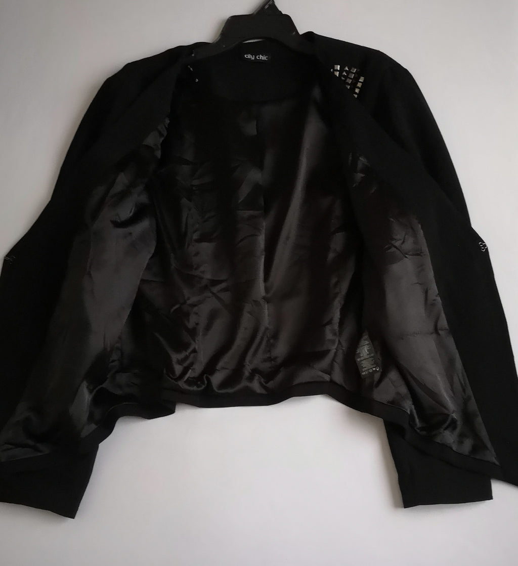 Chaqueta bordada asimétrica